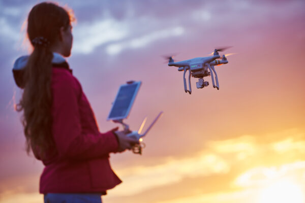 Drone,Flying,At,Sunset